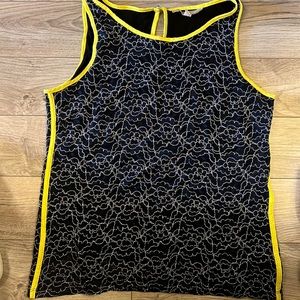 Navy tank with yellow trim in flower crochet fabric.